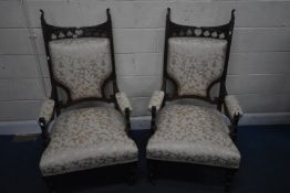 A PAIR OF ARTS AND CRAFTS WALNUT ARMCHAIRS, with clover leaf and heart cut outs, floral gold