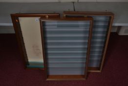 THREE WALL MOUNTED DISPLAY CABINETS, two with plastic front windows, and nine glass shelves,