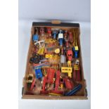 A QUANTITY OF UNBOXED PLAYWORN DIECAST AND PLASTIC FARM TRACTORS AND IMPLEMENTS, to include Britains