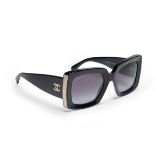 Chanel.  A pair of sunglasses, of square frame design and gilded pattern to the side, with doubl...
