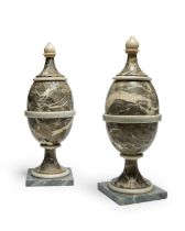 A pair of Italian grey and white marble urns, 19th century, each with spreading cover with finial...