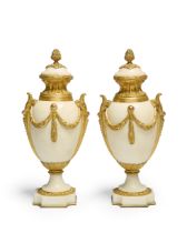 A pair of French gilt-bronze mounted white marble urns, of Louis XVI style, late 19th century, ea...