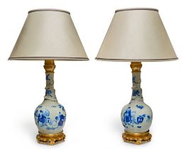 A pair of Chinese blue and white crackle-glaze bottle vase lamps, the porcelain 19th century, wit...