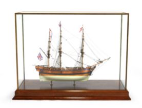 A scale model of 'The Bounty', late 20th century, mounted in a glass case with brass frame, on a ...