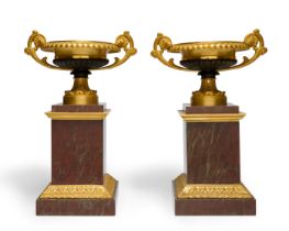 A pair of French gilt and patinated bronze tazza, 19th century, each with scrolling foliate handl...