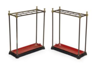 A pair of late Victorian brass and cast iron stick stands, late 19th century, each with ten divis...