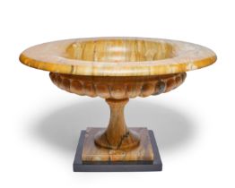 A large Siena marble tazza, 20th century, with half-lobed bowl above a tapering stem to square ba...
