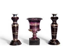 A pair of Derbyshire blue-john candlesticks, 19th century, of tapering form with white metal capi...