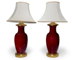 A pair of Chinese sang de boeuf baluster vase lamps, the porcelain 19th century, each with later ...