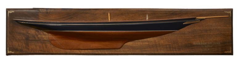 A specimen wood half-block model of the J Class yacht Rainbow, designed by G.L.Watson, carved by ...