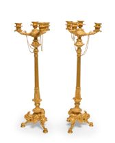 A pair of French gilt-bronze four-light candelabra, late 19th century, each with three branches w...