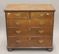 An 18th century walnut chest of drawers. 94.5 cm wide.