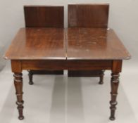 A 19th century mahogany two-leaf extending dining table. 228 cm long extended and 112 cm wide.