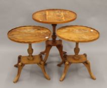 Three modern yew wood side tables. The largest 48 cm long.