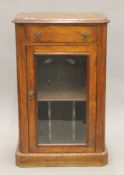 A Victorian walnut side cabinet. 58 cm wide.