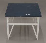 A painted wooden coffee table. 58.5 cm square.