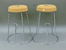 A pair of champagne cork-form stools. 52 cm high.