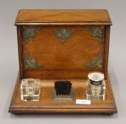 A Victorian oak desk stationery stand. 29 cm wide.