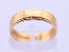 A 22 ct gold wedding band. Ring size M/N. 4.3 grammes.