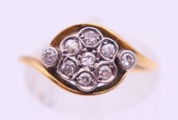 An 18 ct gold and diamond ring. Ring size L.