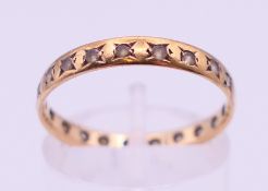 An unmarked gold eternity ring. Ring size O/P.
