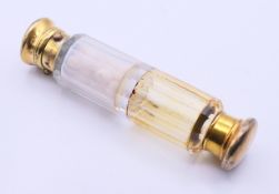 A cased Victorian double-ended silver gilt-mounted scent bottle. 13.5 cm high.