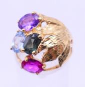 A 18 ct gold multi-gem stone ring. Ring size M/N.