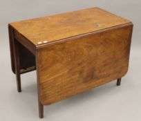 A 19th century mahogany drop-leaf table. 100 cm long.