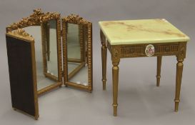 A porcelain-mounted gilt side table and a tryptich mirror. The former 45 cm squared.
