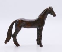 A bronze horse. 9.5 cm long.
