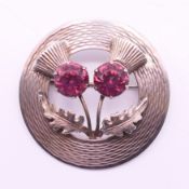 A Scottish silver and amethyst brooch. 4.5 cm diameter.
