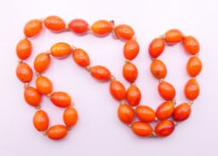 A string of beads. Approximately 60 cm long.