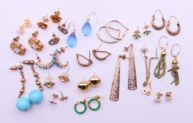 A collection of earrings, including eight pairs of 9 ct gold earrings.