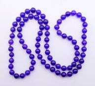 A string of amethyst beads. Approximately 70 cm long.