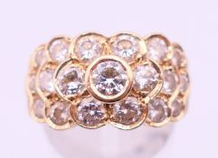 A 14 K gold and diamond cluster ring. Ring size M/N.