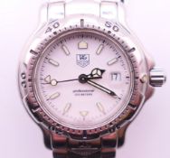 A Tag Heuer ladies' wristwatch. 2.5 cm diameter.