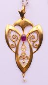 An 18 ct gold Art Nouveau pendant on a chain. Pendant 4.5 cm high, chain 45 cm long. Pendant 2.