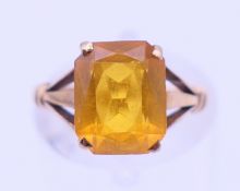 A 9 ct gold and citrine ring. Ring size J/K.