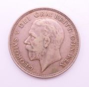 A 1932 Wreath George V crown coin.