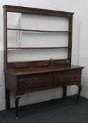 A George III oak dresser. 158 cm wide.