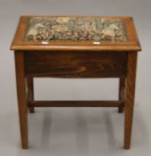 An early 20th century oak piano stool. 52 cm wide.