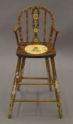 A painted child's high chair painted by Stuart D Knight January 1998. 34 cm wide.