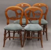 A set of four Victorian balloon-back country chairs with overstuffed solid seats. 40 cm wide.