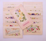 Sixteen World War I embroidered silk postcards including some with note cards.