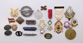 A quantity of badges and pins to include: two US Air force buttons, an Air Training Corps badge,