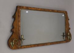 A 19th century walnut girandole mirror. The mirror plate 92 x 45 cm. 120 cm wide overall.