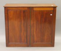 A 19th century mahogany side cupboard. 105 cm wide.