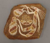 An Aboriginal sandstone painting, indistinctly signed to the reverse. 18 cm wide.