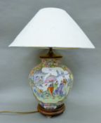 A Chinese porcelain table tamp. 55 cm high including shade.