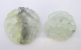 Two pierced jade roundels. The largest 4.5 cm diameter.